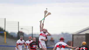 <p>UP FOR IT: De La Salle's Eddie Barrett jumping for the sliotar with Ballygunner's Conor Sheehan tackling behind. Pic: Patrick Browne</p>