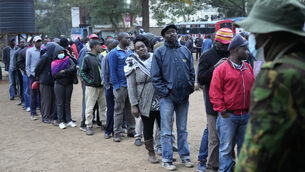People line up to vote at the Moi Avenue Primary School in Nairobi (Khalil Senosi/AP)