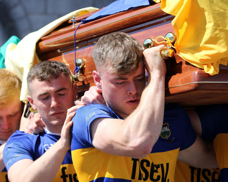  Dillon Quirke's coffin was shouldered almost 2kms to St. John the Baptist Church, as it passed hundreds of silent standing mourners on the way. Picture: Brendan Gleeson