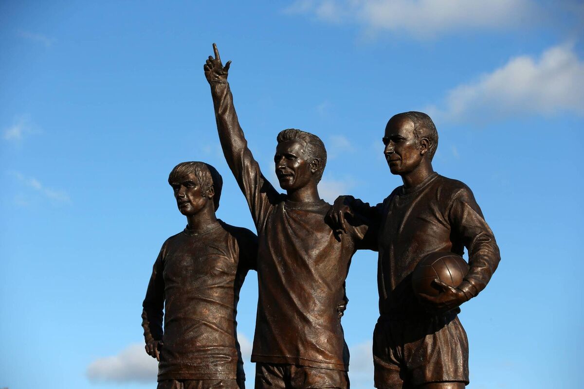 IMMORTALISED: The 'Holy Trinity' statue of Best, Law, and Charlton sits outside Old Trafford. Pic: Alex Livesey/Getty Images