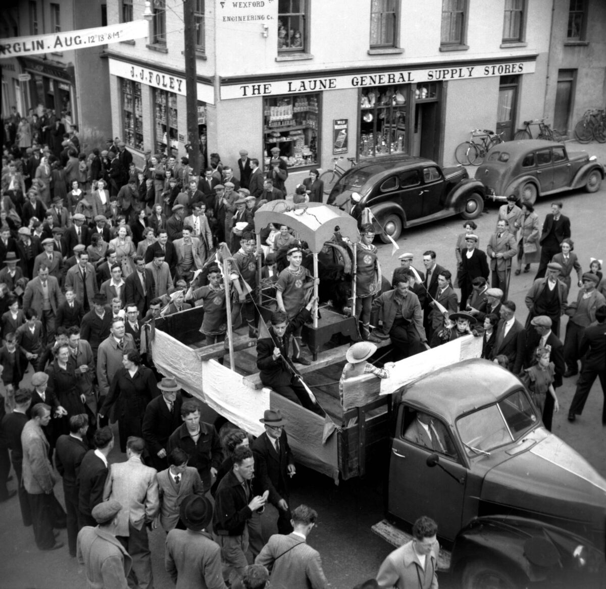 King Puck's loyal courtiers accompanying the wild goat to his coronation at the centuries-old fair in Killorglin, Co Kerry, on August 12, 1951. Picture: Irish Examiner Archive