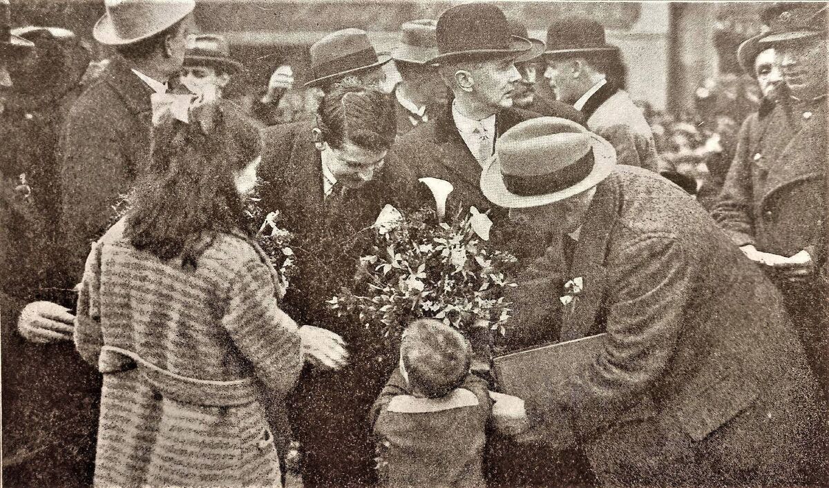 Michael Collins is pictured here receiving a bouquet of flowers from a child during a visit to Cork city shortly before he was killed.
