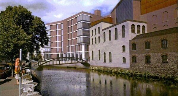 Artist’s impression of the new pedestrian bridge and student apartments, now under construction, planned for a site adjacent to the proposed event centre. Artist’s impression of the new pedestrian bridge and student apartments, now under construction, planned for a site adjacent to the proposed event centre.