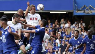 <p>Tottenham's Harry Kane, top, scores his side's second goal during the English Premier League soccer match between Chelsea and Tottenham Hotspur at Stamford Bridge Stadium in London, Sunday, Aug. 14, 2022. (AP Photo/Ian Walton)</p>