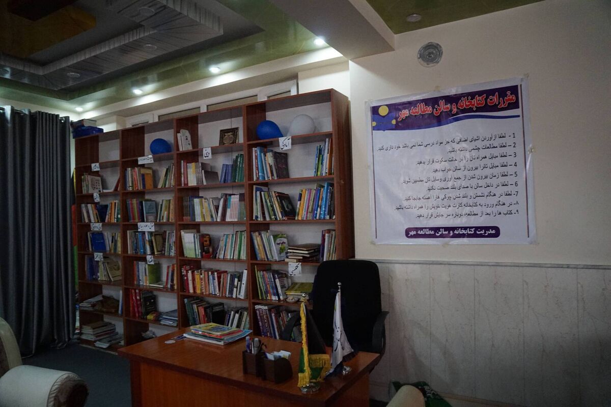 Zahra's library and workspace in West Kabul is a redecorated disused mechanic's garage. 