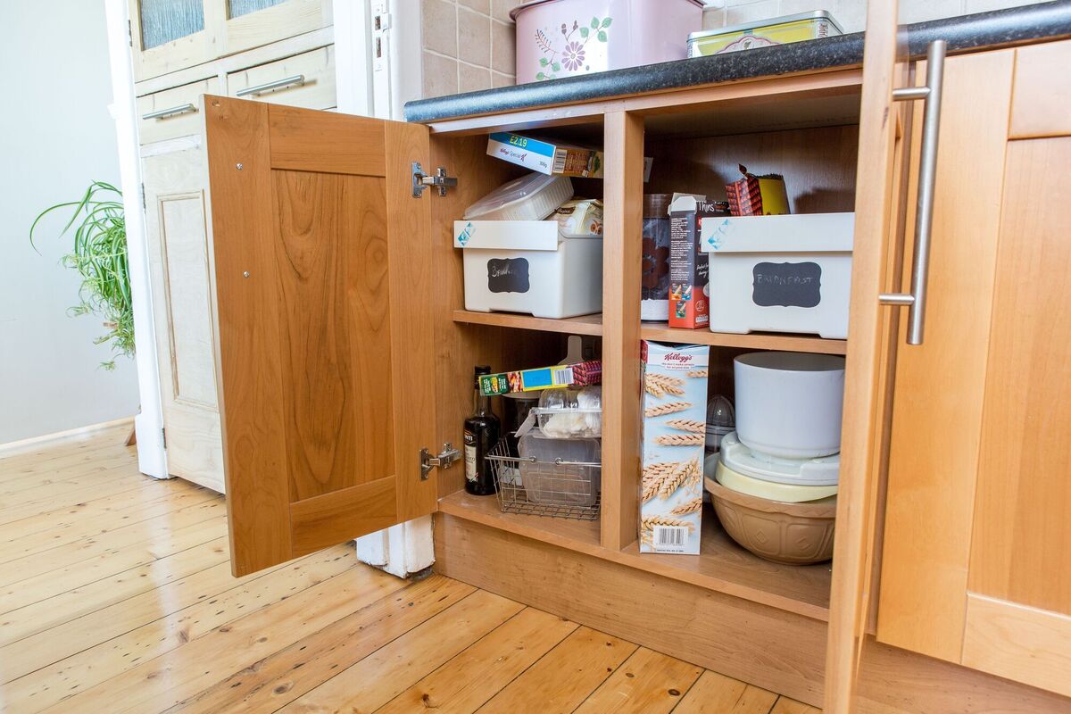 Sarah Reynolds and her team tackle a messy kitchen. Here's the 'before' look with its untidy cabinets. Sarah Reynolds and her team tackle a messy kitchen. Here's the 'before' look with its untidy cabinets.