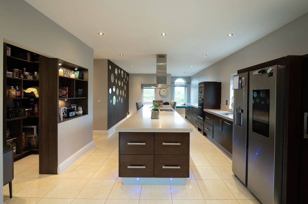 A walk-in pantry features in the kitchen.
