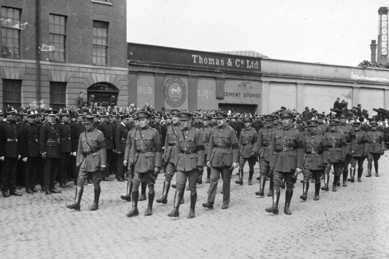The funeral cortege passing Brooks Thomas on Dublin's quays on the way to Glasnevin for the burial of Michael Collins. Photo: Independent News And Media/Getty Images The funeral cortege passing Brooks Thomas on Dublin's quays on the way to Glasnevin for the burial of Michael Collins. Photo: Independent News And Media/Getty Images