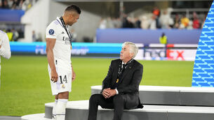 <p>OUTGOING: Real Madrid's Casemiro, left, speaks with Real Madrid's head coach Carlo Ancelotti after winning the UEFA Super Cup. (AP Photo/Sergei Grits)</p>