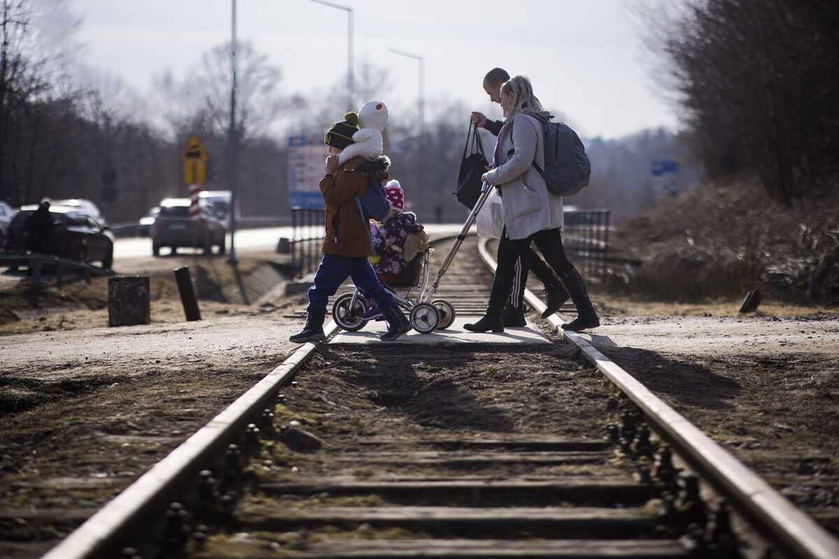 Ukraine refugees cross over the railway tracks at the Krocienko border crossing point on the Poland/Ukraine border in May. Ukrainians understand what reaction to the current war can realistically be expected from tomorrow's Russians. Photo: Toby Madden/DEC/PA