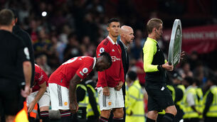 Erik Ten Hag (centre right) introduced Cristiano Ronaldo (centre) in a triple substitution against Liverpool (David Davies/PA)