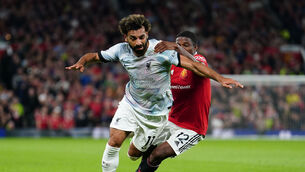 <p>Liverpool's Mohamed Salah (left) and Manchester United's Tyrell Malacia battle for the ball during the Premier League match at Old Trafford. Photo: David Davies/PA Wire.</p>