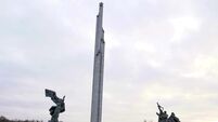 Soviet-era monument’s iconic obelisk comes down in Latvia