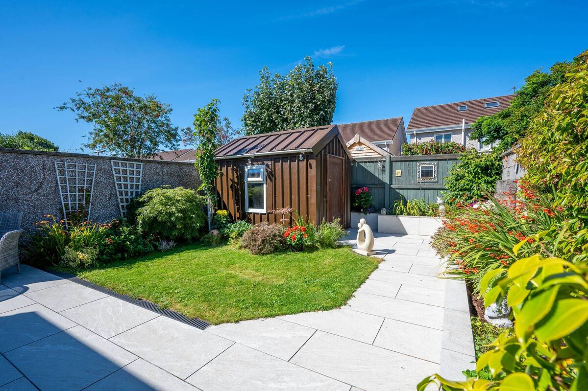 A very neat, landscaped west-facing garden can be found at the property.