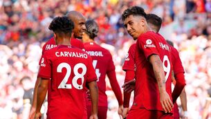<p>NINE OF THE BEST: Liverpool's Roberto Firmino (right) after scoring their side's seventh goal of the game during the Premier League match at Anfield, Liverpool. Pic: Peter Byrne/PA Wire.</p>