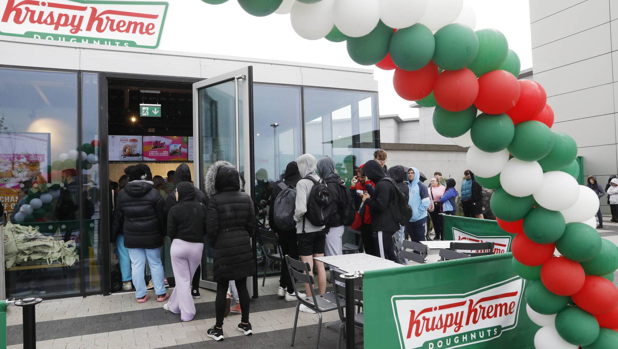 A queue gathers outside Krispy Kreme Liffey Valley Store on its opening day in June. Picture: Leon Farrell/Photocall Ireland
