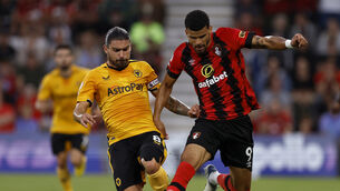 Ruben Neves makes a tackle on Bournemouth’s Dominic Solanke (Steven Paston/PA)