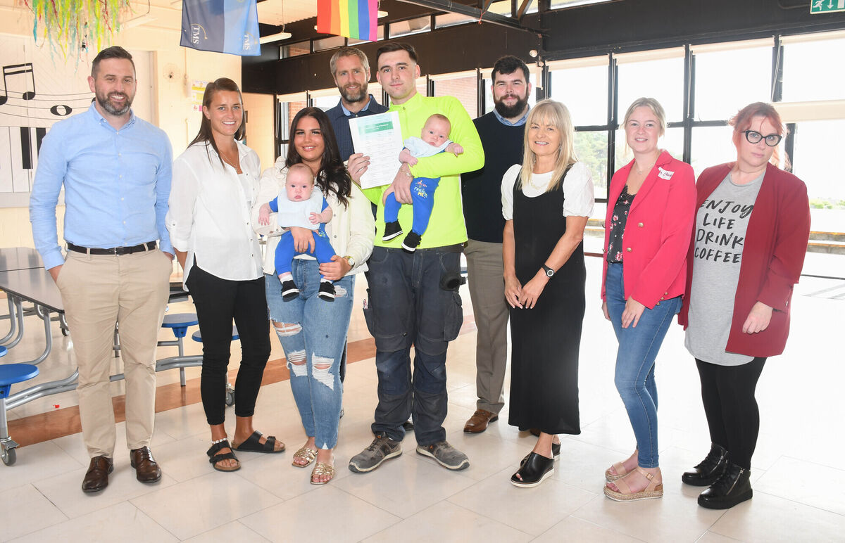 Michael Normoyle his partner Gemma Kelleher, their twin babies Charlie and Joey, and some of the staff from the school including principal Phil O'Flynn. Picture: Howard Crowdy Michael Normoyle his partner Gemma Kelleher, their twin babies Charlie and Joey, and some of the staff from the school including principal Phil O'Flynn. Picture: Howard Crowdy