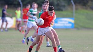 <p>TUSSLE: Mallow's Shane Merritt tries to escape the attention of William Hurley, Valley Rovers. Pic: Jim Coughlan.</p>