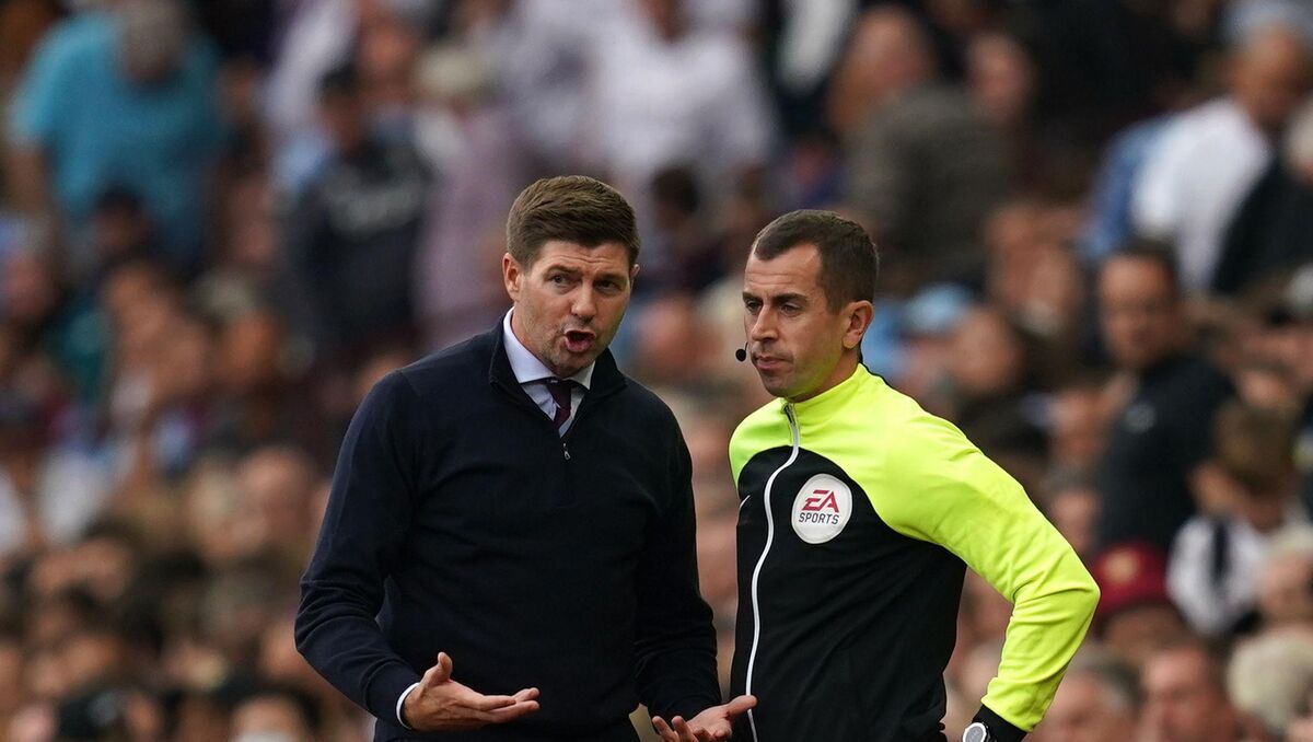 Aston Villa manager Steven Gerrard speaks to fourth official Peter Bankes