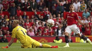 <p>DEBUT DELIGHT: Manchester United's Antony, right, scores his side's opening goal past Arsenal's goalkeeper Aaron Ramsdale at Old Trafford. Pic: AP Photo/Dave Thompson</p>