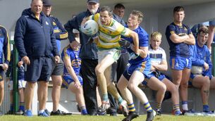 <p>CLOSE ATTENTION: St Finbarr's Bill O'Donnell tackles Carbery Rangers' Alan Jennings at Ballinascarthy on Sunday. Pic: Denis Boyle</p>