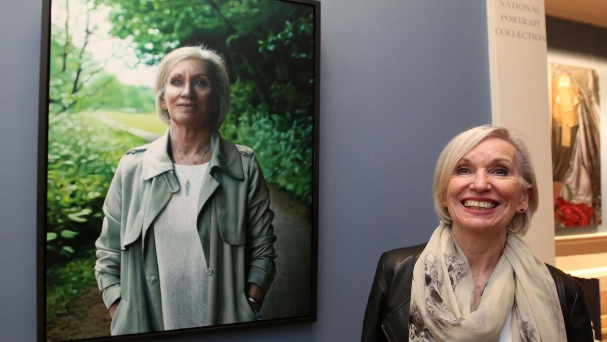 Professor Marie Cassidy with the portrait of herself by artist Jack Hickey at the Gallery’s National Portrait Collection.