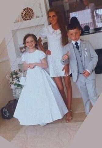 Twins Chelsea and Christy Cawley celebrating their communion with their sister Lisa Cash. 	Picture: Garda Press Office