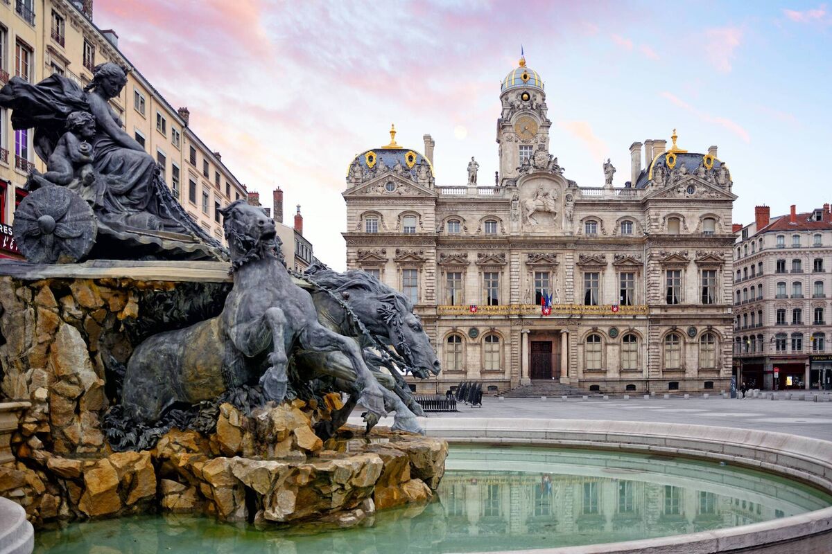Fontaine Bartholdi and Lyon City Hall on the Place des Terreaux square in Lyon, France. World Heritage Site by UNESCO.