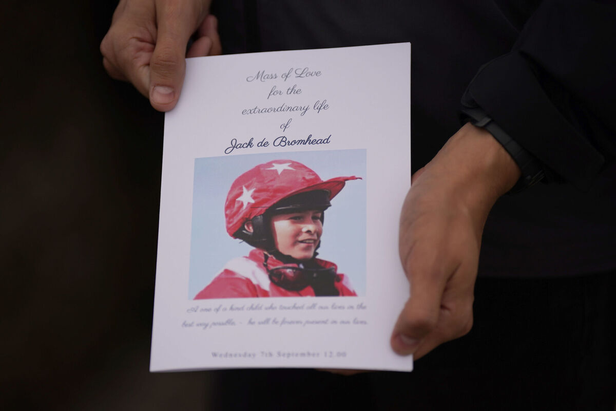A mourner holds a mass booklet for the funeral for Jack de Bromhead. Picture: Niall Carson/PA Wire