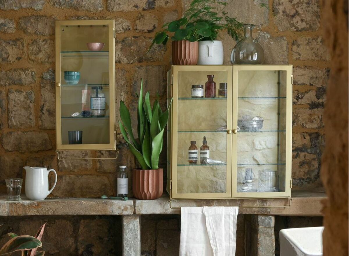 Marie, a tall and slim vintage-inspired wall cabinet with an antiqued gold finish and three removeable glass shelves, €250, grahamandgreen.co.uk