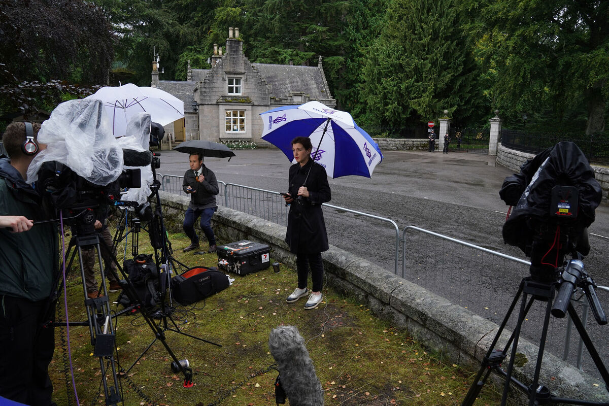 Media gather at the entrance to Balmoral in Scotland, where Queen Elizabeth is under medical supervision. Picture: Andrew Milligan/PA Wire