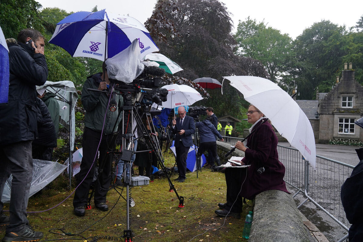 Media continue to gather outside the gates of Balmoral in Scotland, where the Queen is under medical supervision. Picture: Andrew Milligan/PA Wire