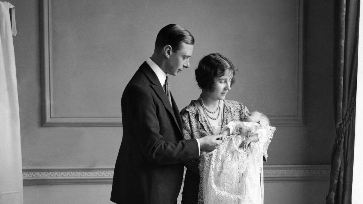 Britain's Queen Mother, then duchess of York, with her husband, King George VI, then duke of York, and their daughter Queen Elizabeth II at her christening in May 1926. Britain's Queen Mother, then duchess of York, with her husband, King George VI, then duke of York, and their daughter Queen Elizabeth II at her christening in May 1926.