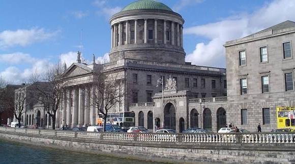 Group has 'barricaded' itself into building earmarked for 500 housing units, High Court told