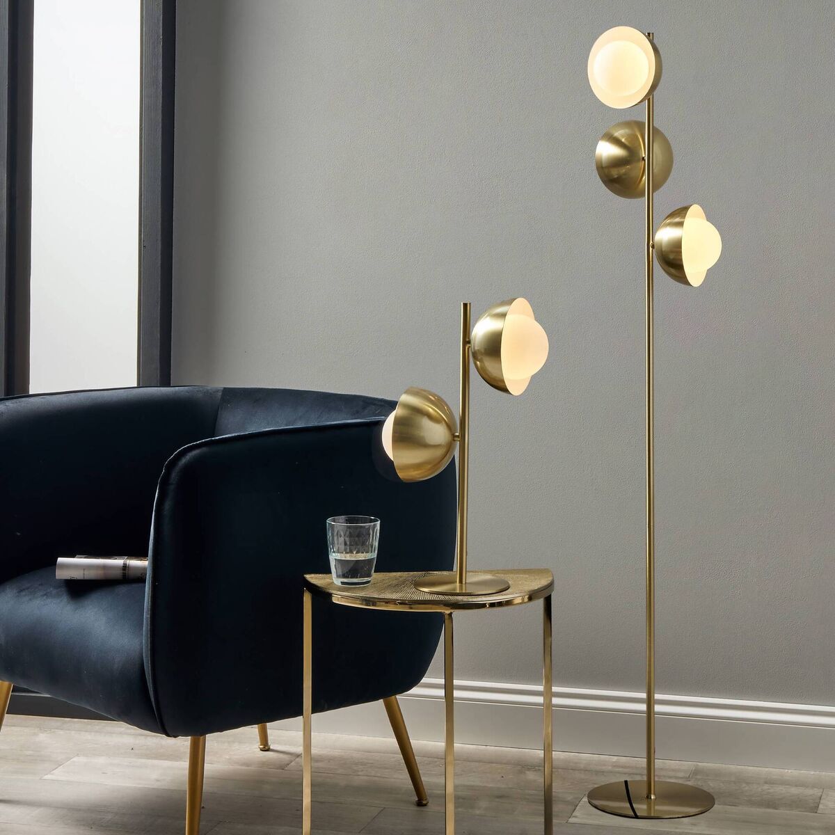 Brass metal and white orb dome floor lamp, €140, and metal and white orb dome table lamp, €95, both Harvey Norman. 