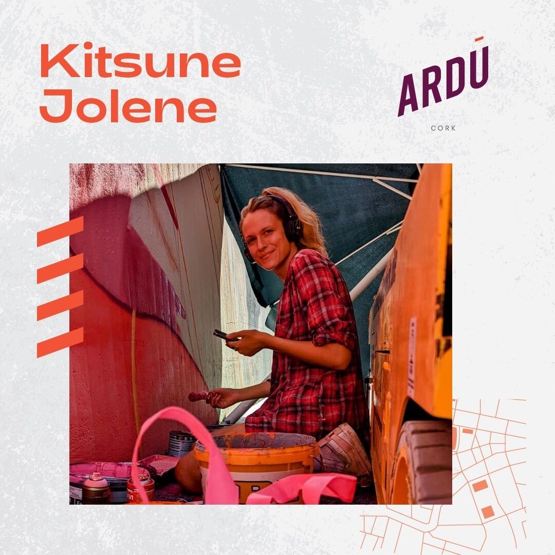 Kitsune Jolene working on a piece of street art.
