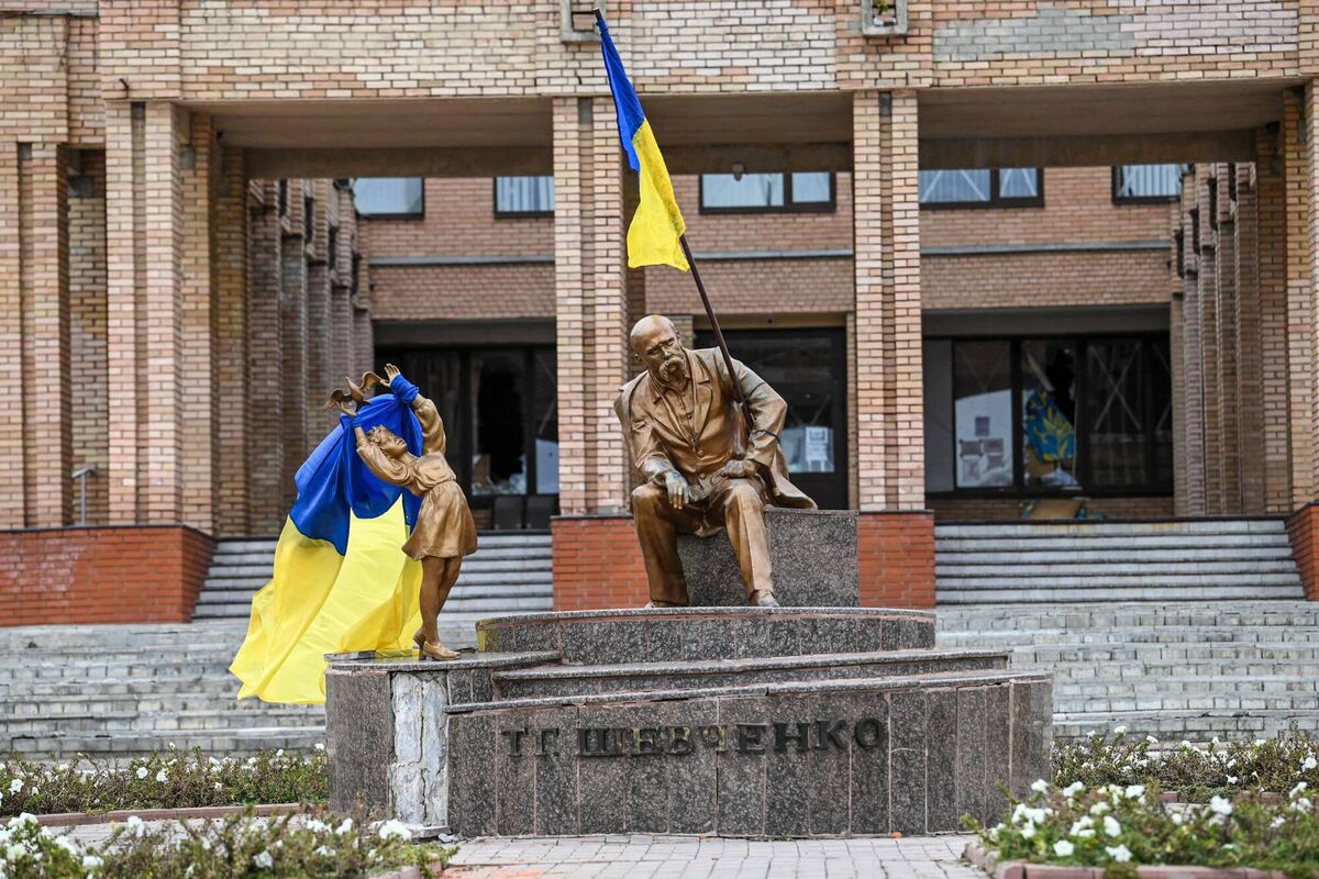 Ukrainian flags placed on statues in a square in Balakliya, Kharkiv region, on Saturday. Picture: Juan Barreto / AFP via Getty Images)