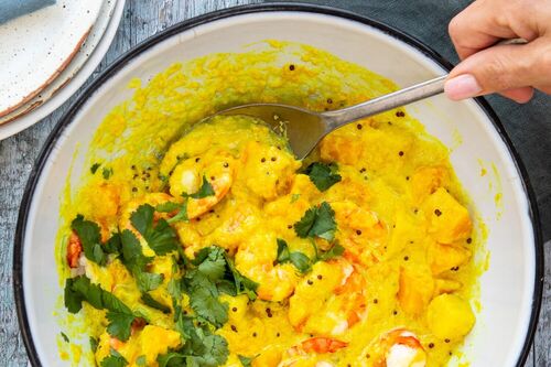 Yellow coconut curry with tiger prawns