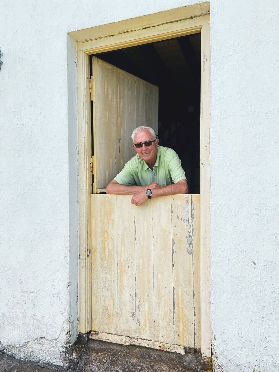 Denis Scannell,  Irish Examiner photographer at the front door of Peig Sayers' house on the Blasket Islands. Picture Claire Scannell
