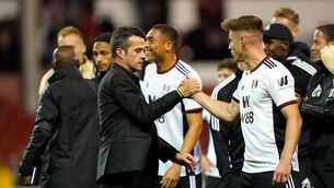 <p>Moving on up": Fulham manager Marco Silva and player Tom Cairney (right) celebrate after the final whistle in the Premier League match at The City Ground, Nottingham. Pic: Tim Goode/PA Wire.</p>
