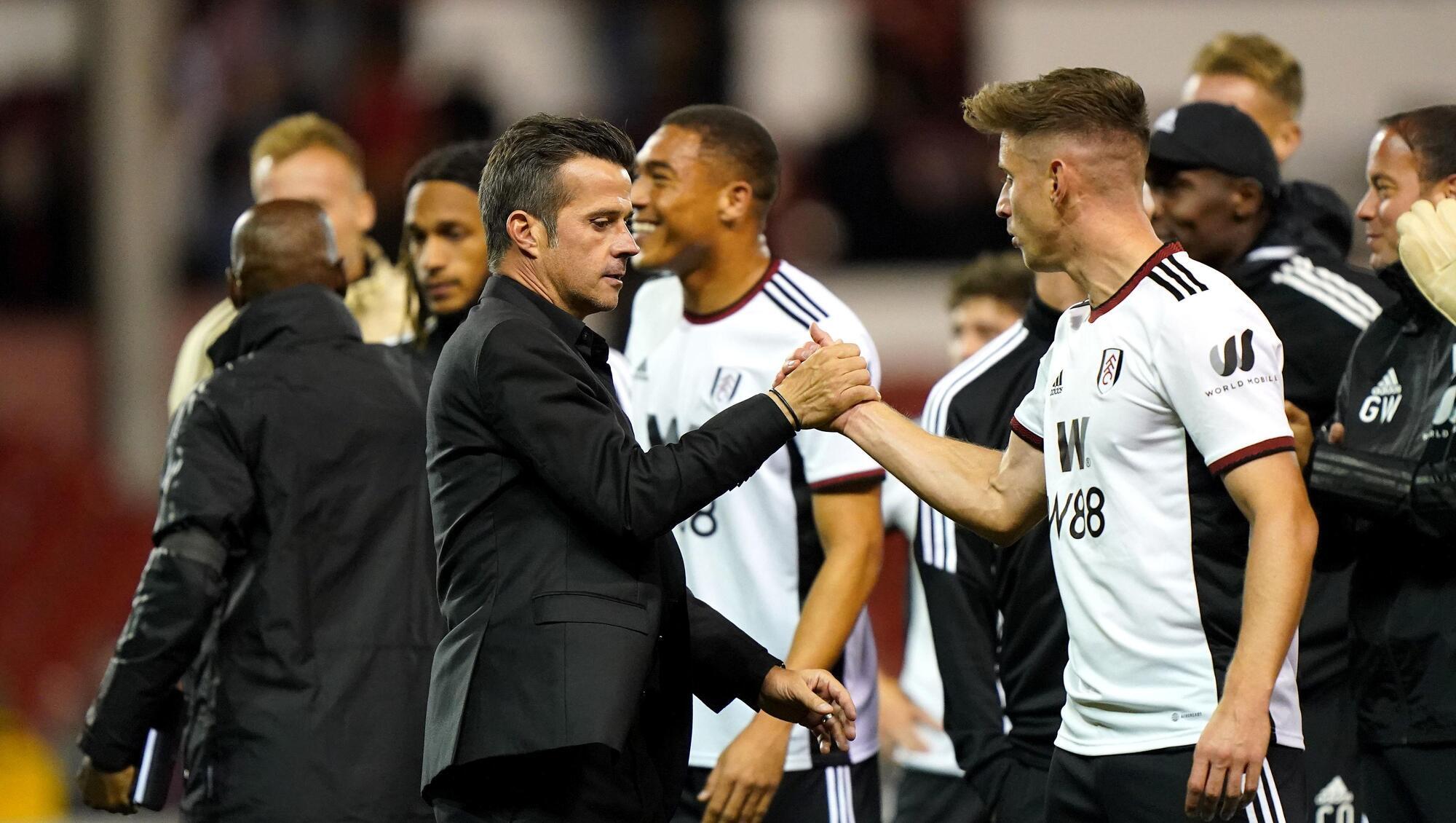 Moving on up": Fulham manager Marco Silva and player Tom Cairney (right) celebrate after the final whistle in the Premier League match at The City Ground, Nottingham. Pic: Tim Goode/PA Wire.