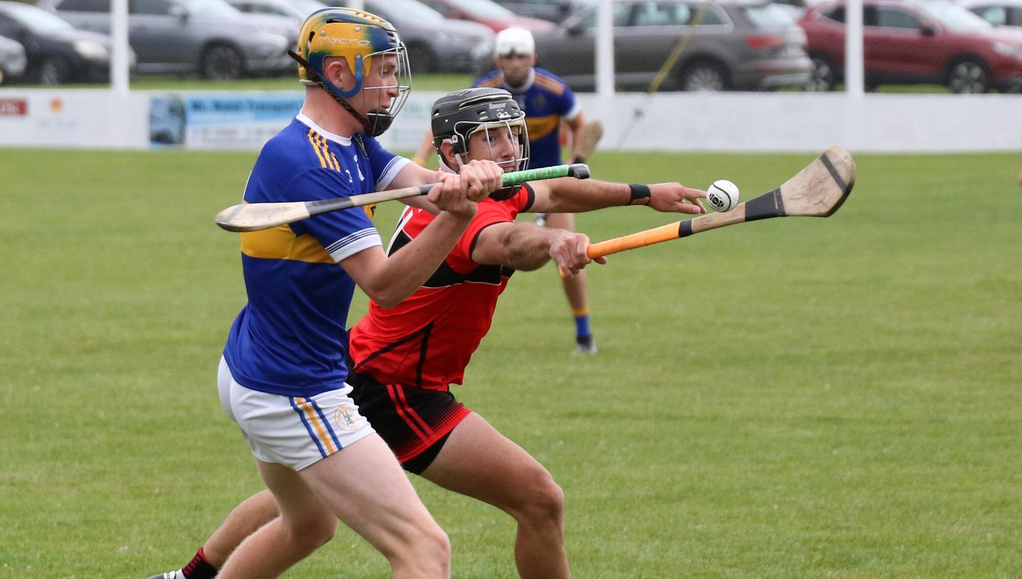 Cian Fitzgerald, Patrickswell and John Fitgibbon, Adare, clashing for the sliotar in the Senior Hurling Championship tie in Askeaton