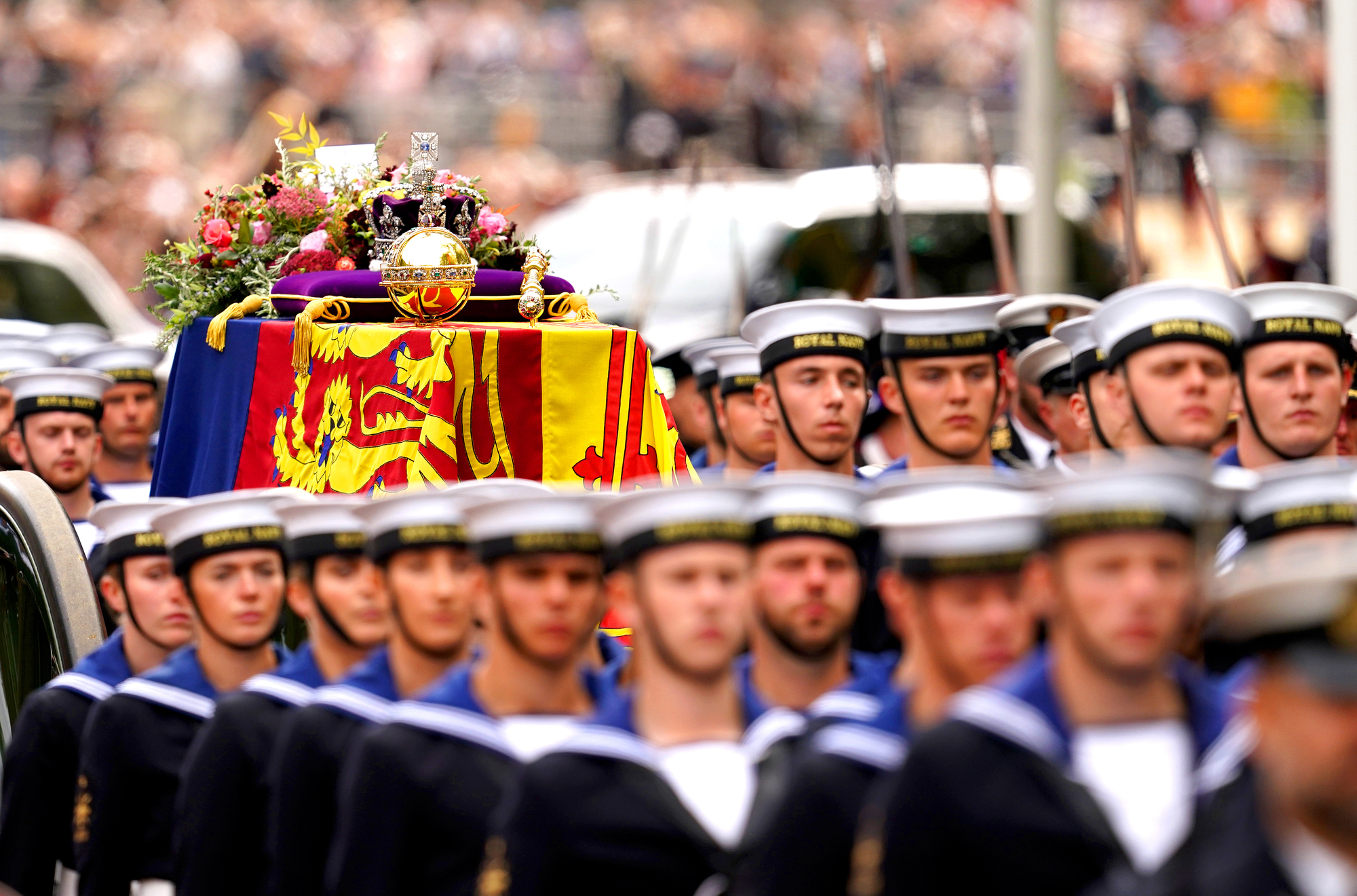 Police and military personnel collapse while guarding Queen Elizabeth II's funeral route