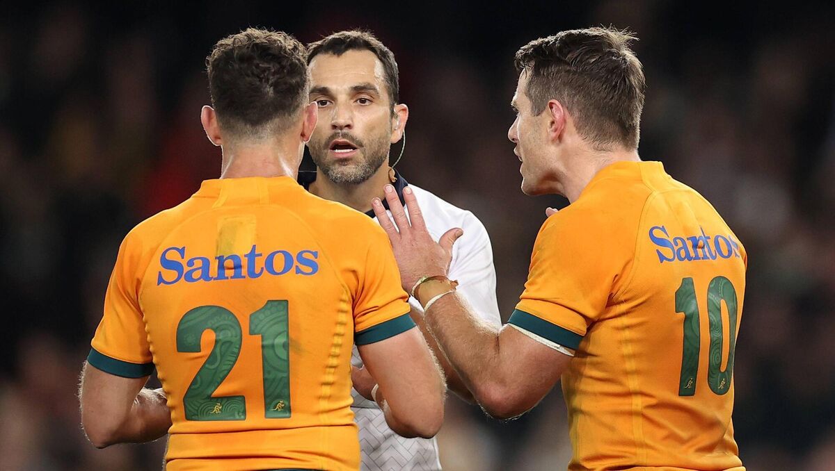 TIME-WASTING; Mathieu Raynal explains his decision to Australia's Nic White and Bernard Foley. Pic: Cameron Spencer/Getty Images