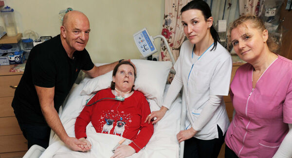 Catherine O'Leary, Carrigaline, who suffers with Locked-In Syndrome with her father Pat, her nurse Ella Luca and her carer Eva Gaspar (right).