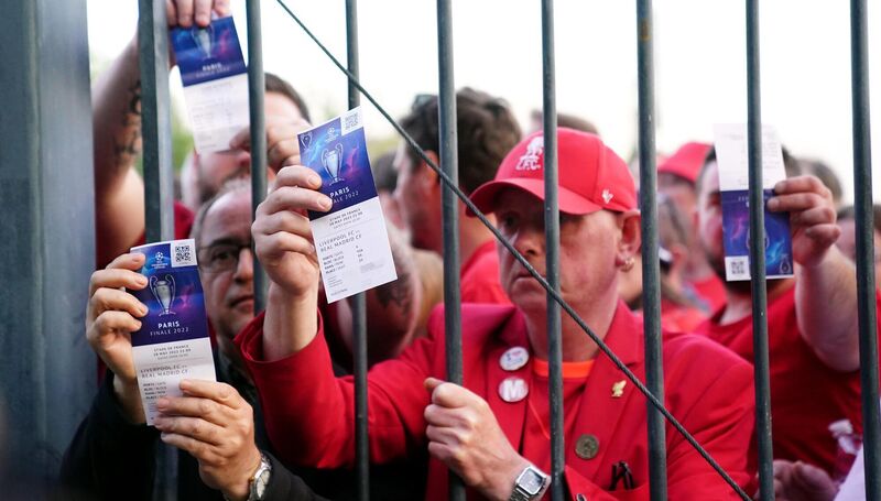 Night of shame: Liverpool fans stuck outside the ground show their match tickets during the UEFA Champions League Final at the Stade de France, Paris. Pic: PA Wire Night of shame: Liverpool fans stuck outside the ground show their match tickets during the UEFA Champions League Final at the Stade de France, Paris. Pic: PA Wire