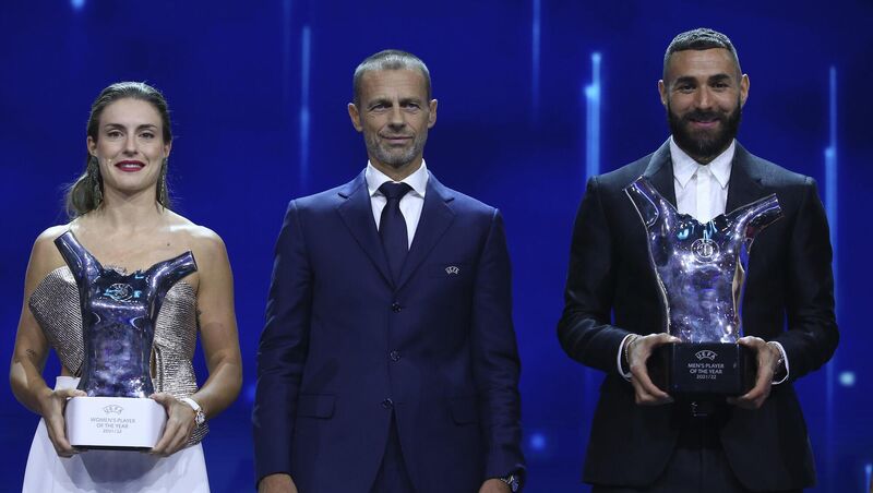 Front and centre: Barcelona's Alexia Putellas, left, and Real Madrid's Karim Benzema, right, hold their trophies as Women's and Men's players of the year next to UEFA president Aleksander Ceferin during the soccer Champions League draw ceremony in Istanbul, Turkey. Pic: AP Photo/Emrah Gurel Front and centre: Barcelona's Alexia Putellas, left, and Real Madrid's Karim Benzema, right, hold their trophies as Women's and Men's players of the year next to UEFA president Aleksander Ceferin during the soccer Champions League draw ceremony in Istanbul, Turkey. Pic: AP Photo/Emrah Gurel