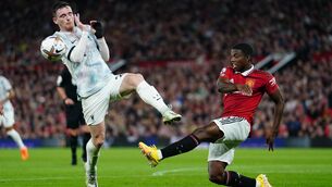 <p>Liverpool's Andy Robertson (left) and Manchester United's Tyrell Malacia battle for the ball during the Premier League match at Old Trafford in Manchester on August 22, 2022.</p>