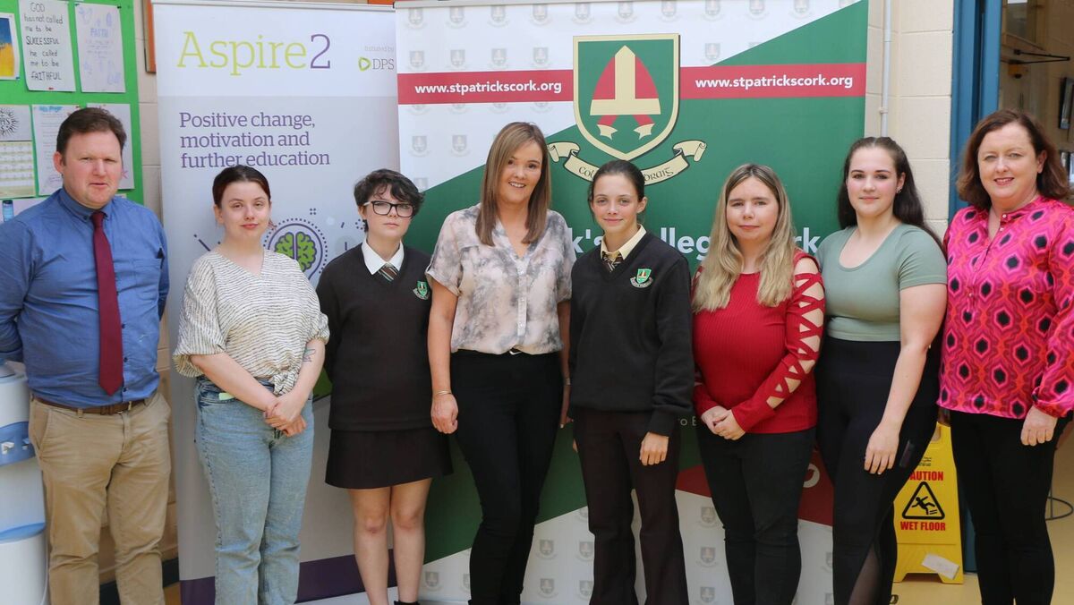 Principal Brian Cronin pictured with Deputy Principal Ms Falvey  alongside present and past pupils at one of the school's careers events.